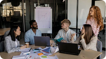 Investment advisory meeting with charts on a whiteboard